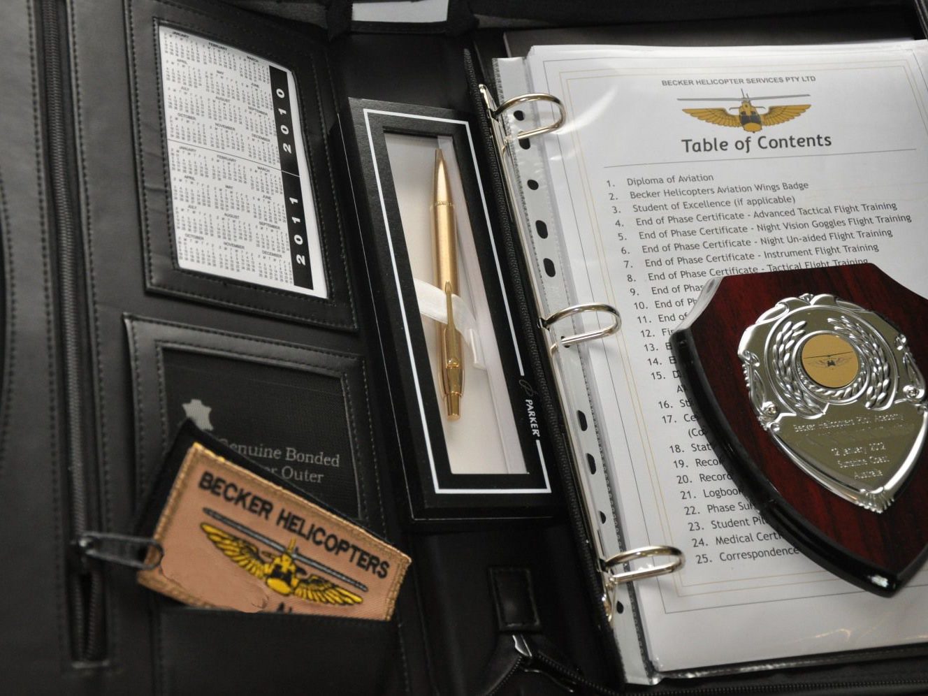 Graduation Folder showing Certificates received on completion of the Initial Entry Rotary Wing Pilot Program