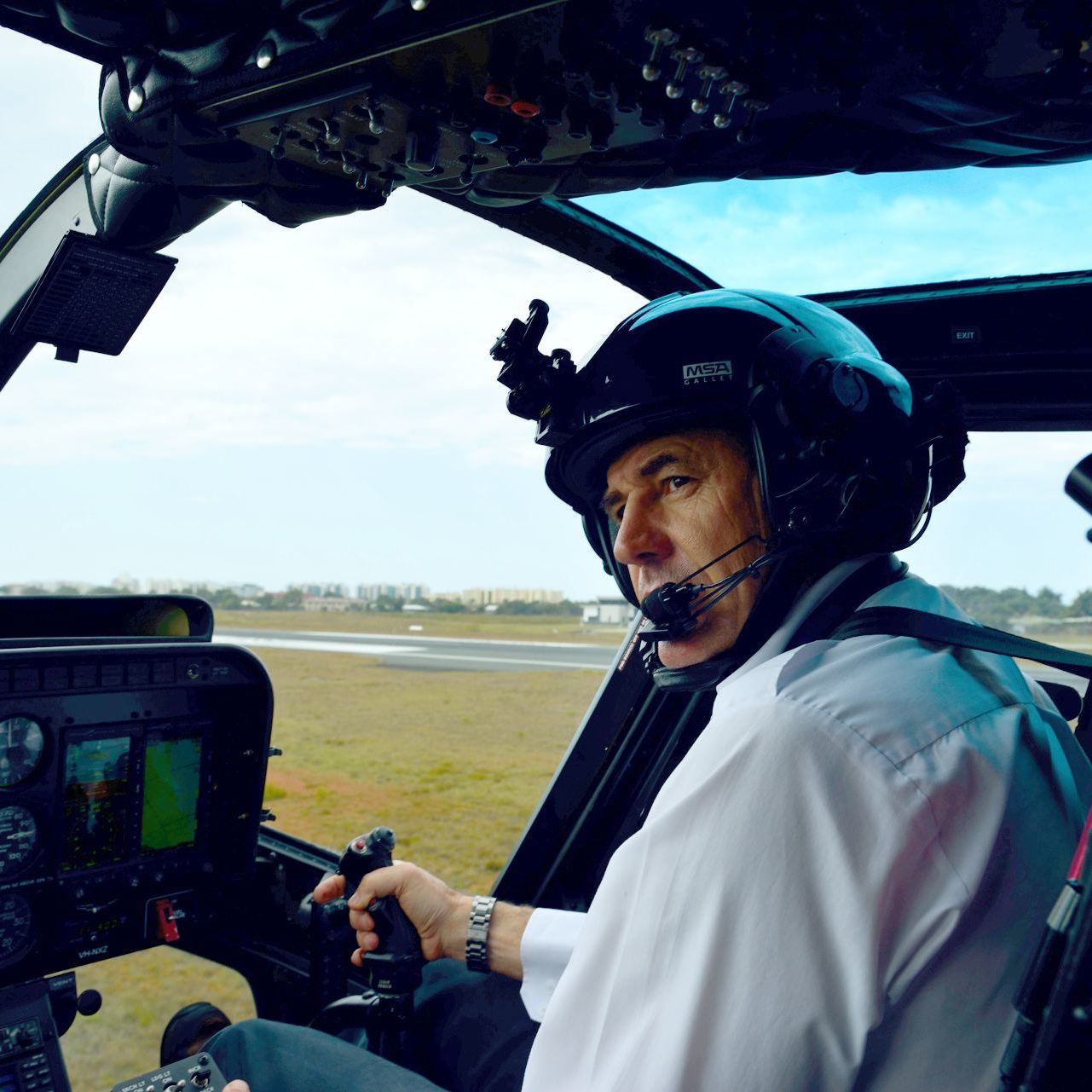 Captain Mike Becker in the cockpit of a Bell 206 Jet Ranger
