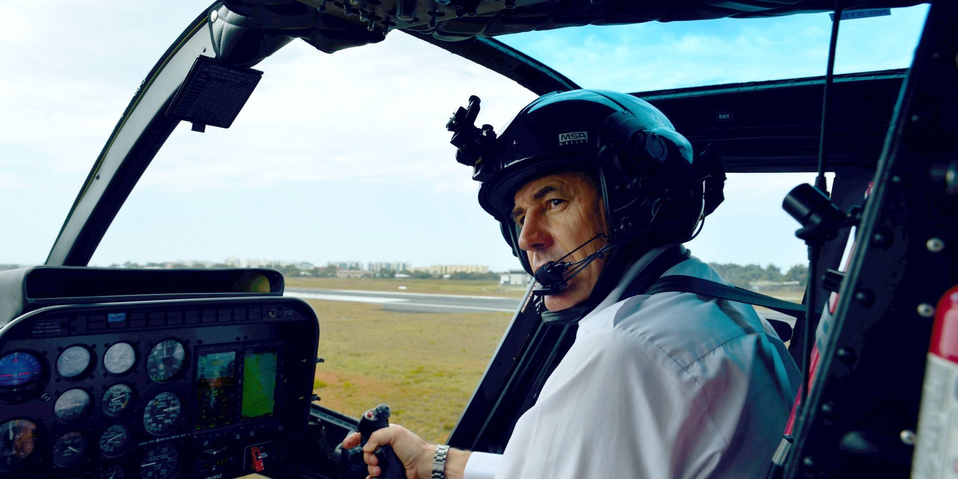 Captain Mike Becker in the cockpit of a Bell 206 Jet Ranger