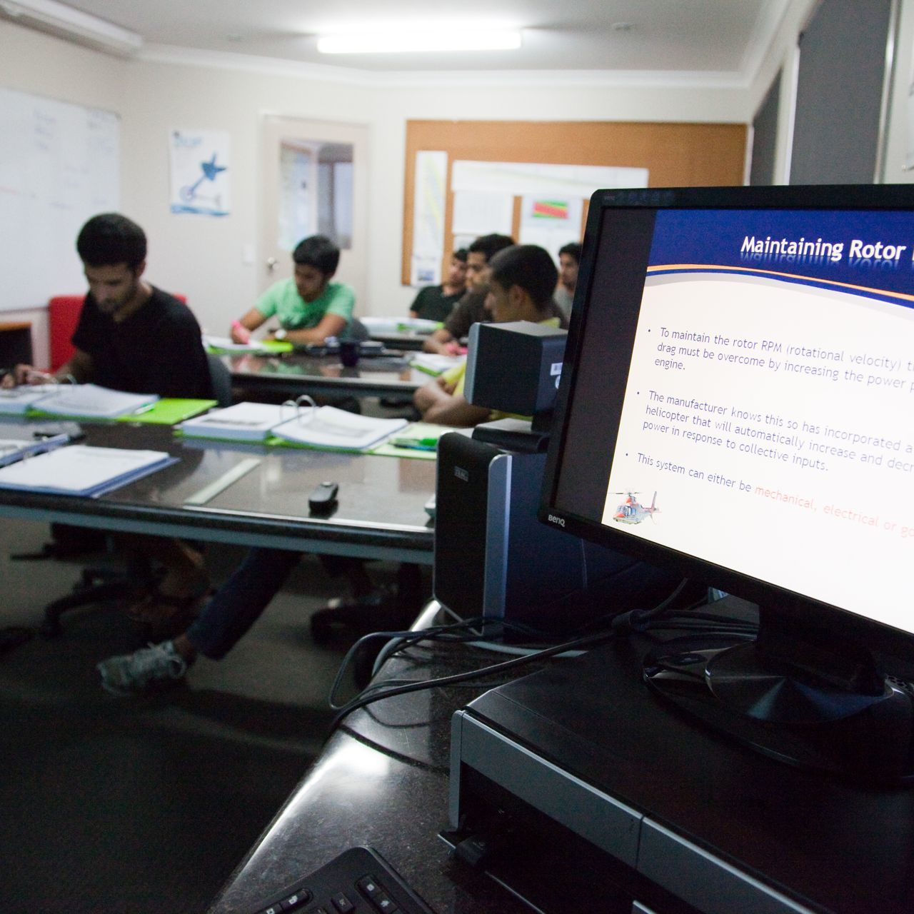 Pilot trainees studying in a classroom