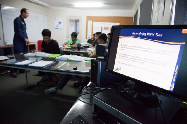 Pilot trainees studying in a classroom