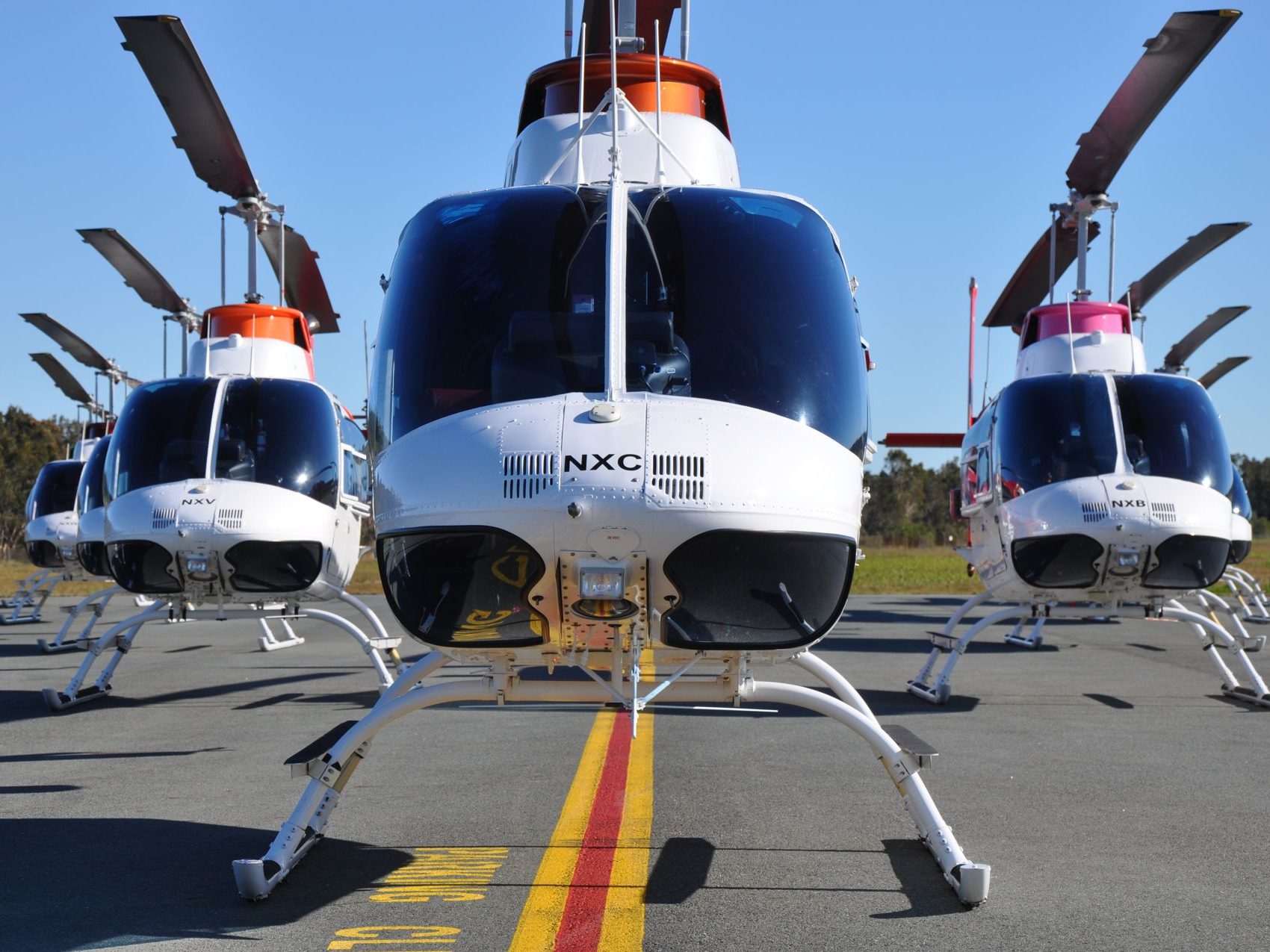 Front view of the B206BIII Jet Ranger fleet in formation