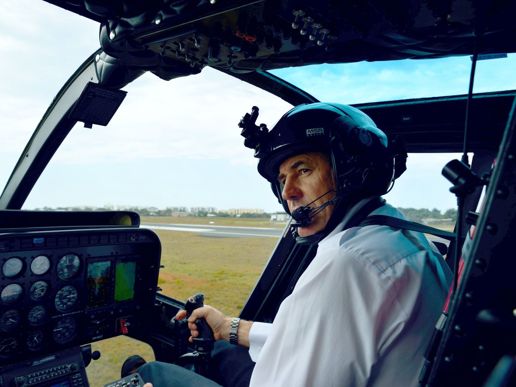 Captain Mike Becker in the cockpit of a Bell 206 Jet Ranger