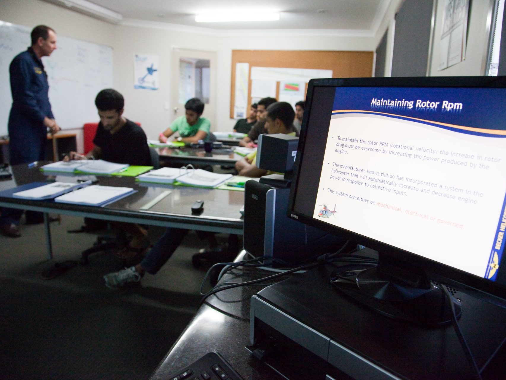 Pilot trainees studying in a classroom